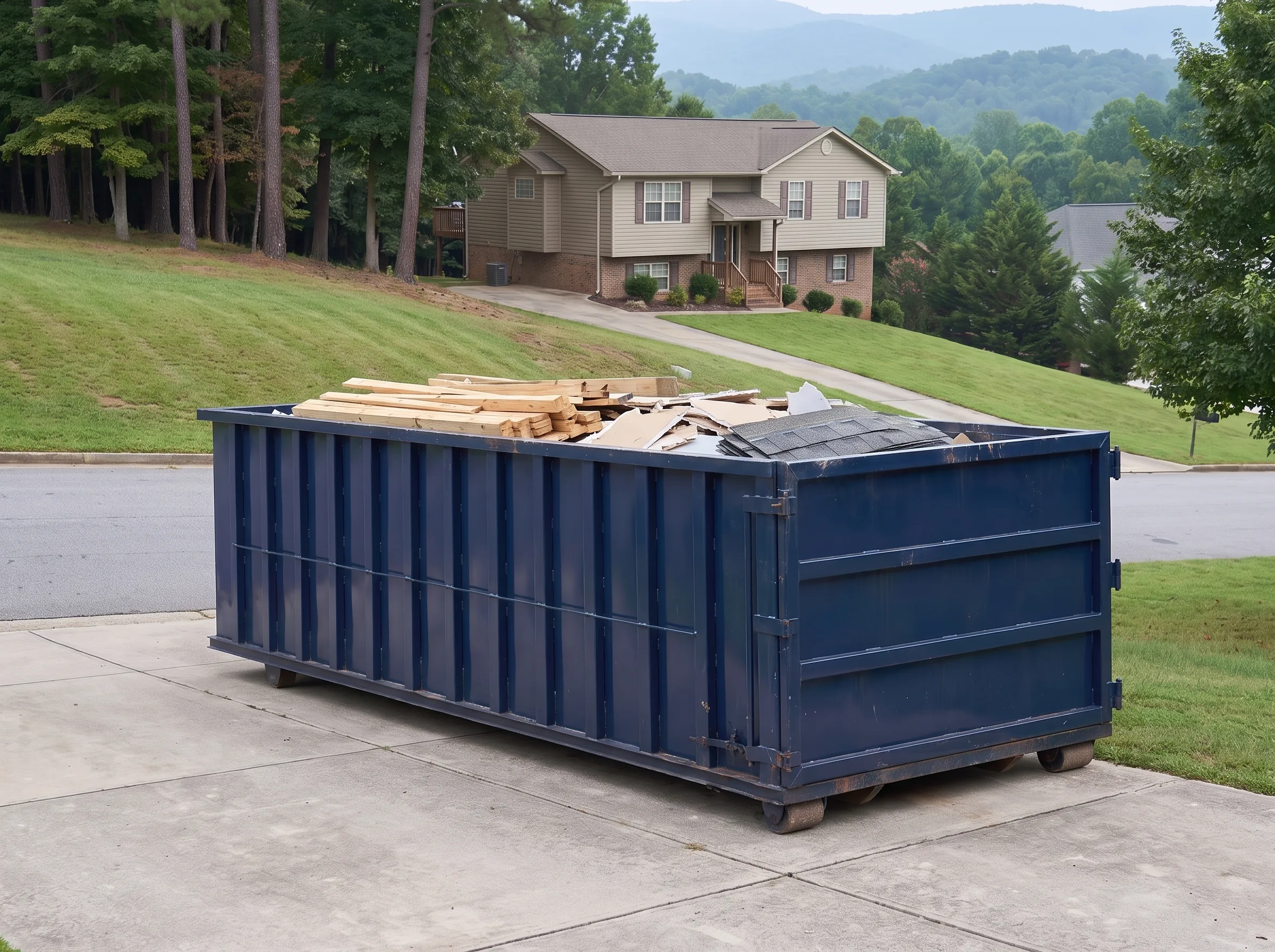 Roll-off dumpster being loaded in Franklin County, NC